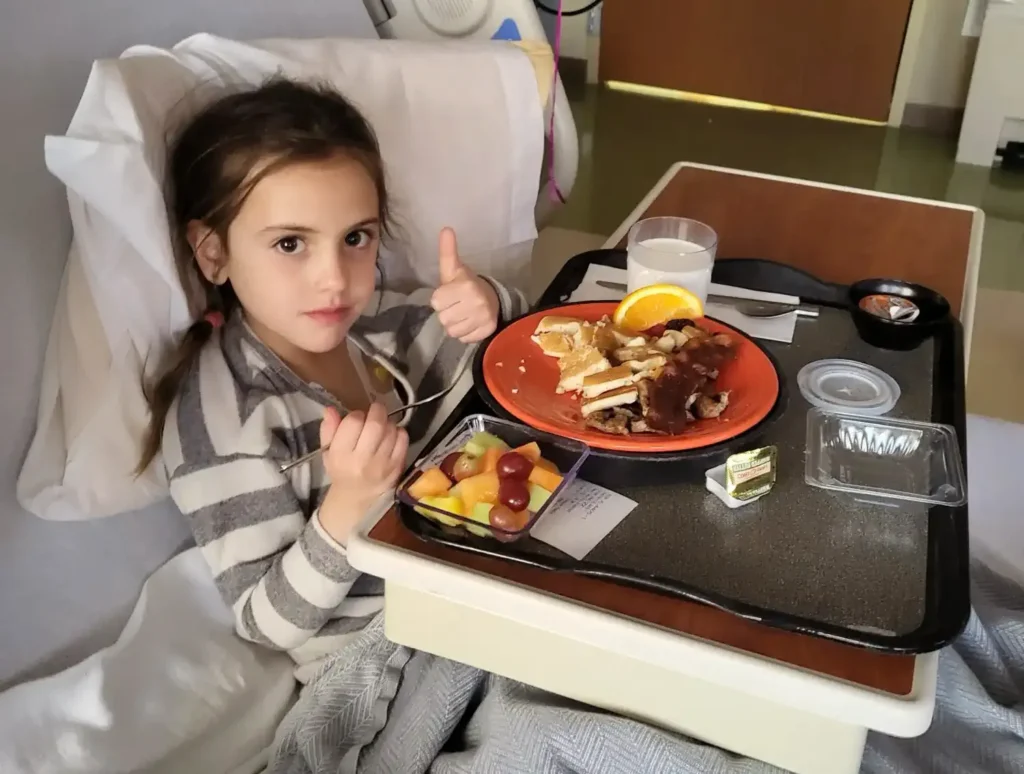 child in hospital bed cropped